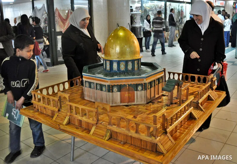 Palestinians participate in an exhibition in the first Palestinian Heritage Jerusalem, in the West Bank city of Nablus, April. 14, 2012. Photo by Nedal Shtieh.