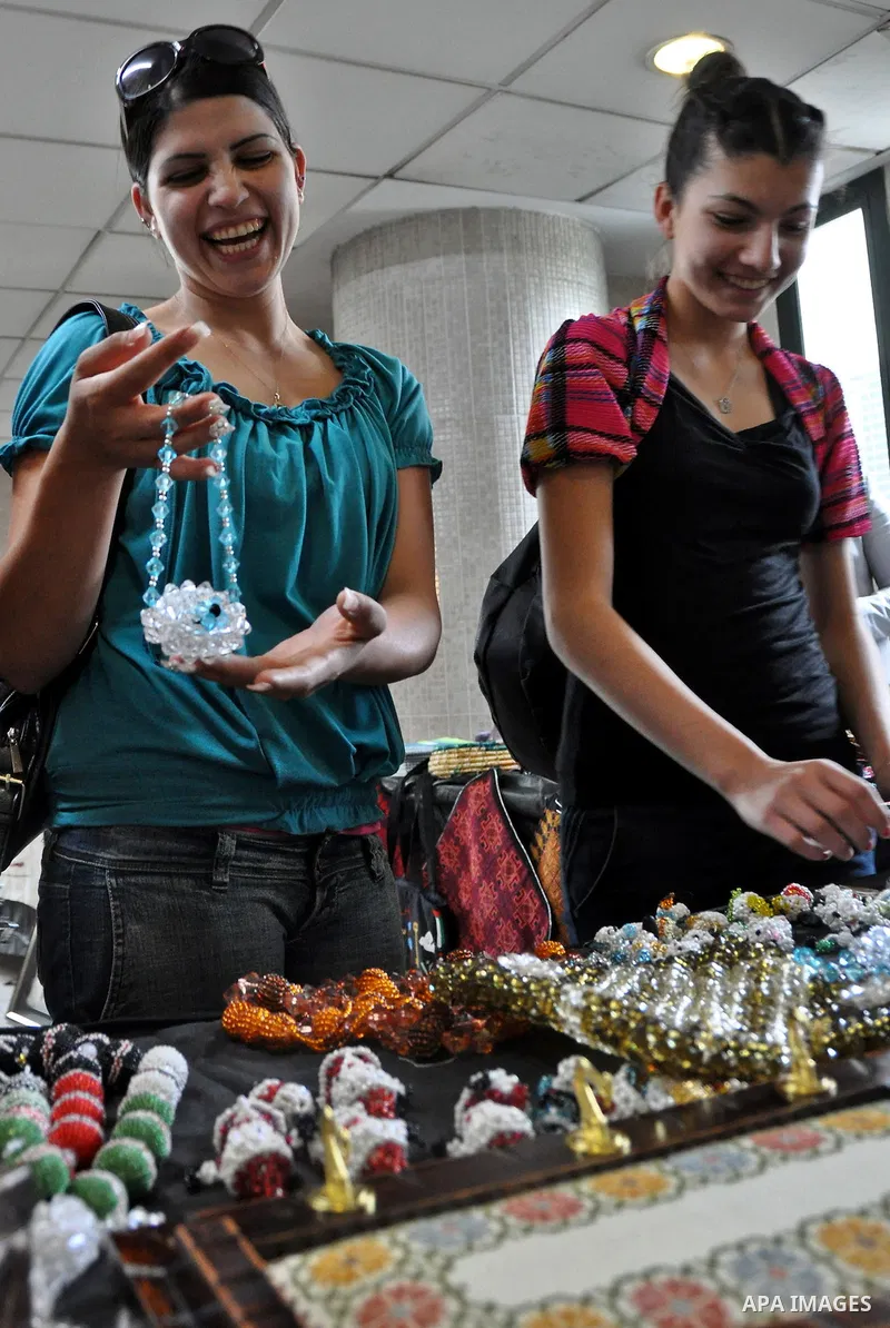 Palestinians participate in an exhibition in the first Palestinian Heritage Jerusalem, in the West Bank city of Nablus, April. 14, 2012. Photo by Nedal Shtieh.