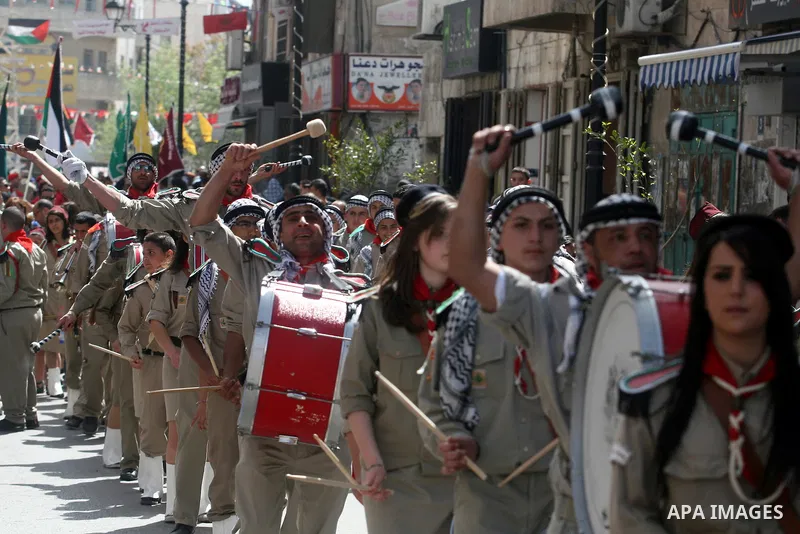 Palestinian Christians take part in the "Holy Fire" procession on the eve of Orthodox Easter in the West Bank city of Ramallah on April 14, 2012. The date of Orthodox Easter is calculated differently than by the Roman Ca...