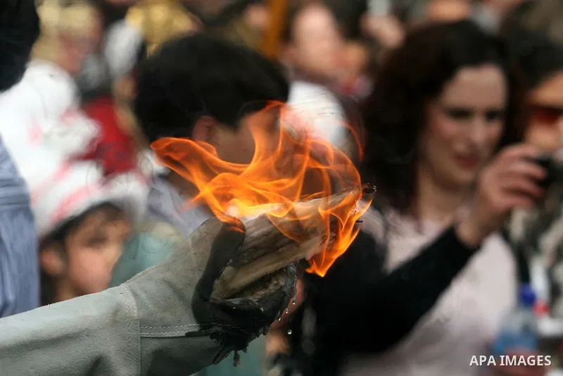 Palestinian Christians take part in the "Holy Fire" procession on the eve of Orthodox Easter in the West Bank city of Ramallah on April 14, 2012. The date of Orthodox Easter is calculated differently than by the Roman Ca...
