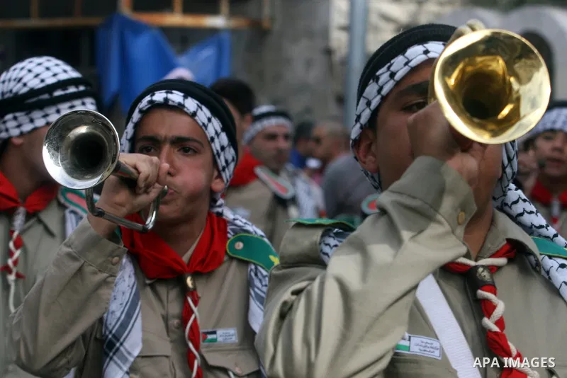 Palestinian Christians take part in the "Holy Fire" procession on the eve of Orthodox Easter in the West Bank city of Ramallah on April 14, 2012. The date of Orthodox Easter is calculated differently than by the Roman Ca...