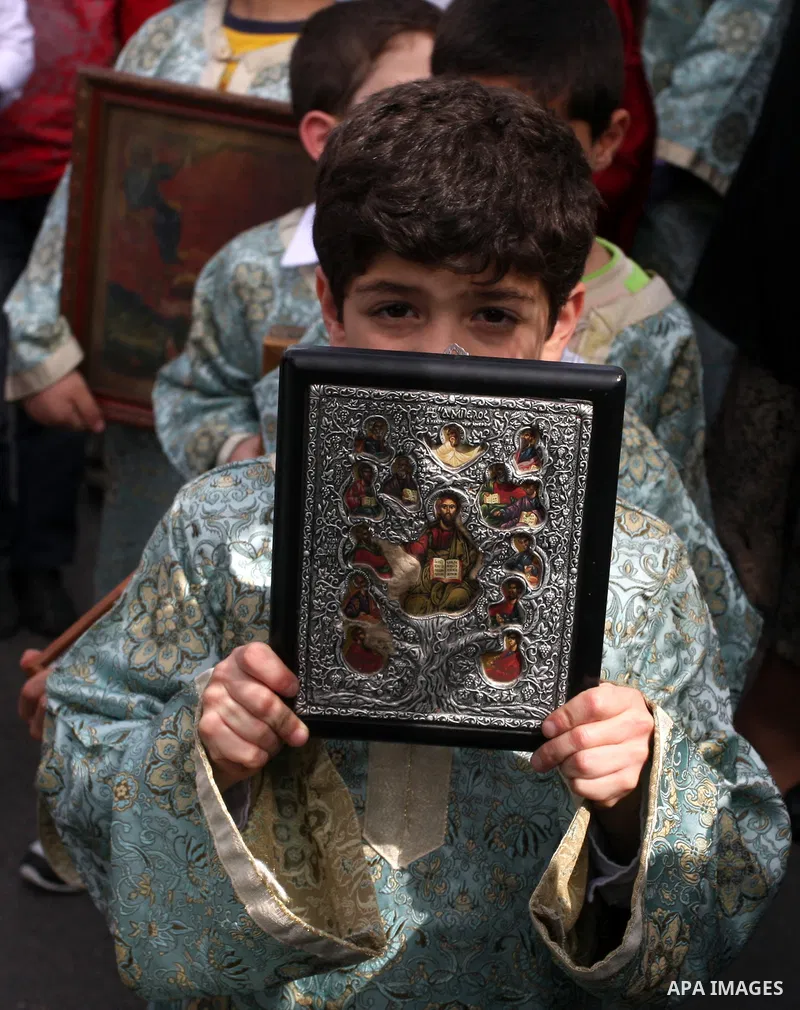 Palestinian Christians take part in the "Holy Fire" procession on the eve of Orthodox Easter in the West Bank city of Ramallah on April 14, 2012. The date of Orthodox Easter is calculated differently than by the Roman Ca...