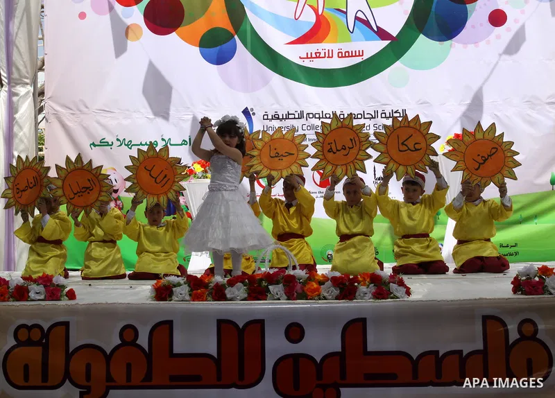 Palestinian children take part in a celebration to mark the International Children Day in Gaza city on April, 15, 2012. Photo by Mohammed Asad