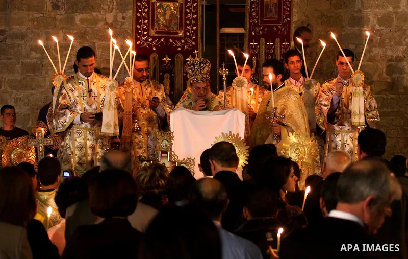 Palestinian Christians take part in the "Holy Fire" procession on the eve of Orthodox Easter in Gaza city on April 14, 2012. The date of Orthodox Easter is calculated differently than by the Roman Catholics and other chu...
