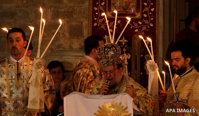 Palestinian Christians take part in the "Holy Fire" procession on the eve of Orthodox Easter in Gaza city on April 14, 2012. The date of Orthodox Easter is calculated differently than by the Roman Catholics and other chu...