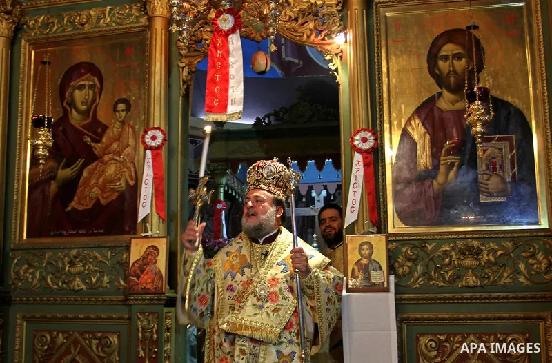 Palestinian Christians take part in the "Holy Fire" procession on the eve of Orthodox Easter in Gaza city on April 14, 2012. The date of Orthodox Easter is calculated differently than by the Roman Catholics and other chu...