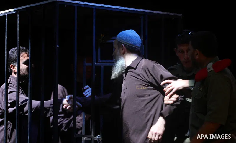 Palestinians perform a play depicting Palestinian prisoners in an Israeli jail in Gaza City on April 16, 2012 on the eve of Prisoners' Day, an annual event during which people hold demonstrations and rallies of solidarit...