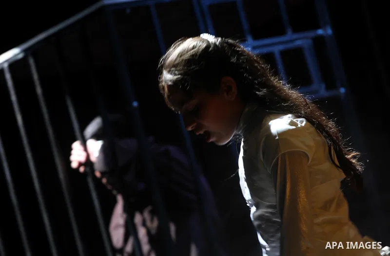 Palestinians perform a play depicting Palestinian prisoners in an Israeli jail in Gaza City on April 16, 2012 on the eve of Prisoners' Day, an annual event during which people hold demonstrations and rallies of solidarit...