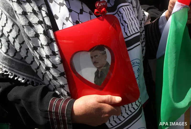 Palestinian protesters wave national flags during a rally in Gaza City on April 17, 2012 in solidarity with Palestinian prisoners held in Israel. Some 1,200 Palestinian prisoners held in Israeli jails have begun a hunger...