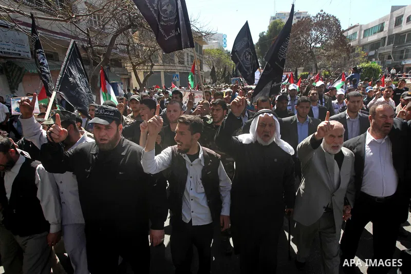 Palestinian factions demonstrate in solidarity with prisoners jailed in Israel on the annual prisoners day, in Gaza City, Tuesday, April 17, 2012. The Israeli prison service said Tuesday hundreds of Palestinian prisoners...