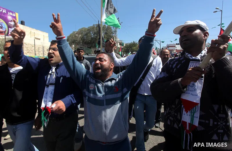 Palestinians demonstrate in solidarity with prisoners jailed in Israel on the annual prisoners day, in Gaza City, Tuesday, April 17, 2012. The Israeli prison service said Tuesday hundreds of Palestinian prisoners have la...