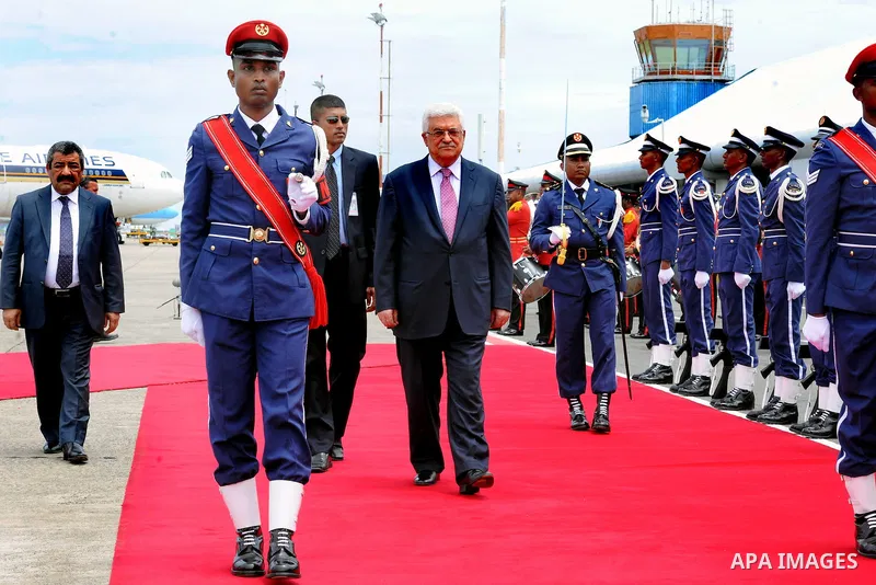 Palestinian President Mahmoud Abbas, received by Maldives President, Mohammed Waheed Hassan, upon arrival at the airport in Male, Maldives, Tuesday, April 17, 2012. Photo by Thaer Ganaim