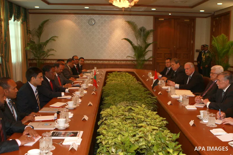 Palestinian President Mahmoud Abbas, received by Maldives President, Mohammed Waheed Hassan, upon arrival at the airport in Male, Maldives, Tuesday, April 17, 2012. Photo by Thaer Ganaim
