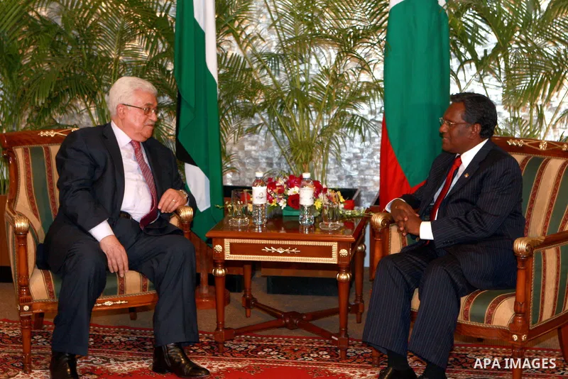 Palestinian President Mahmoud Abbas, received by Maldives President, Mohammed Waheed Hassan, upon arrival at the airport in Male, Maldives, Tuesday, April 17, 2012. Photo by Thaer Ganaim