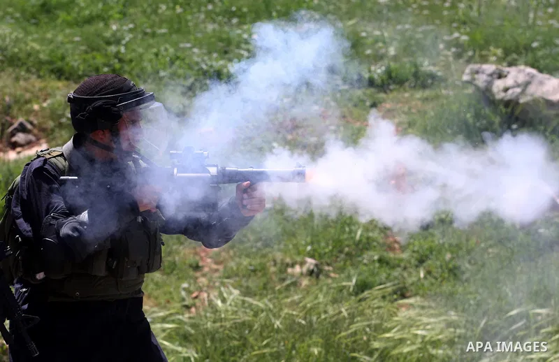 Israeli soldiers fire teargas during clashes with Palestinian protesters following a demonstration to mark the Prisoners' Day near Israels Ofer prison, between Jerusalem and Ramallah on April 17, 2012. At least 1,200 Pa...