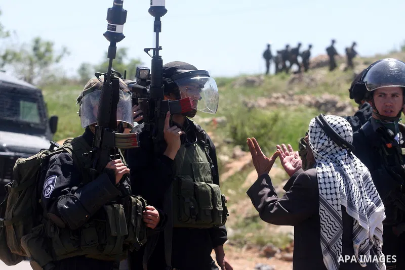 Israeli soldiers fire teargas during clashes with Palestinian protesters following a demonstration to mark the Prisoners' Day near Israels Ofer prison, between Jerusalem and Ramallah on April 17, 2012. At least 1,200 Pa...
