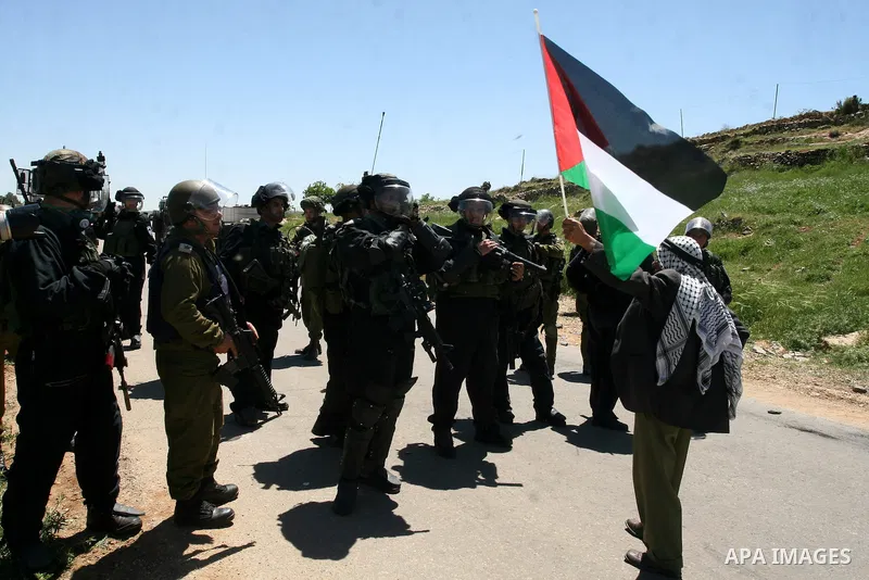 Israeli soldiers fire teargas during clashes with Palestinian protesters following a demonstration to mark the Prisoners' Day near Israels Ofer prison, between Jerusalem and Ramallah on April 17, 2012. At least 1,200 Pa...