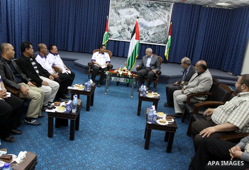 Palestinian Prime Minister in Gaza Strip, Ismail Haniya receives Malaysia delegation in his office in Gaza city on April 18, 2012. Photo by Mohammed As