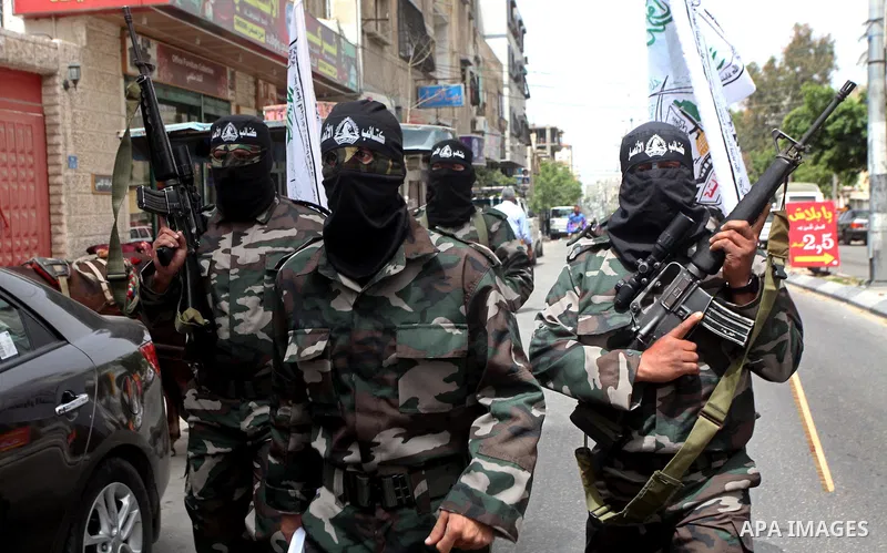 Palestinian militants of the Al-Ahrar Brigades, take part in a press conference, in Gaza city on April, 18, 2012 to announces readiness to defend the Palestinian prisoners in Israeli jails. Photo by Ashraf Amra