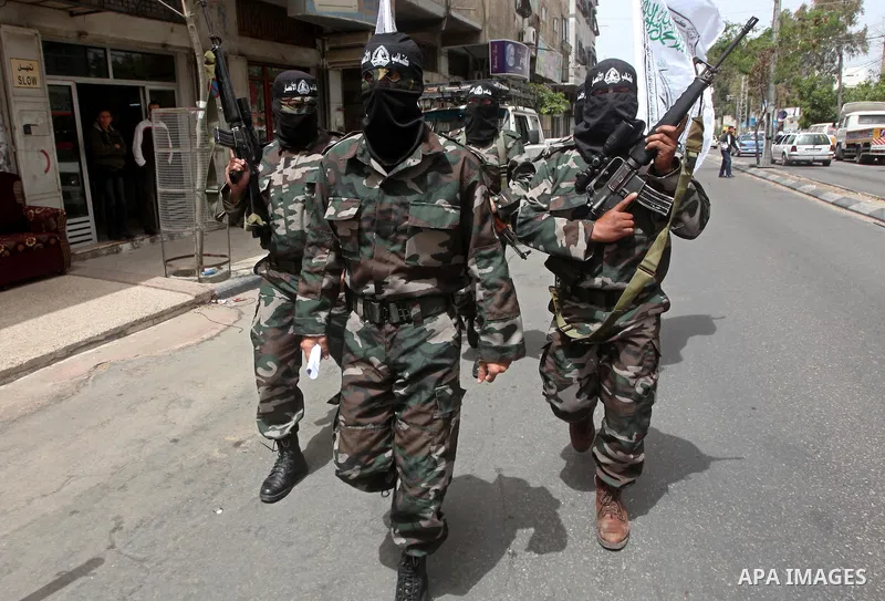 Palestinian militants of the Al-Ahrar Brigades, take part in a press conference, in Gaza city on April, 18, 2012 to announces readiness to defend the Palestinian prisoners in Israeli jails. Photo by Ashraf Amra