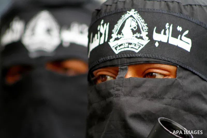 Palestinian militants of the Al-Ahrar Brigades, take part in a press conference, in Gaza city on April, 18, 2012 to announces readiness to defend the Palestinian prisoners in Israeli jails. Photo by Ashraf Amra
