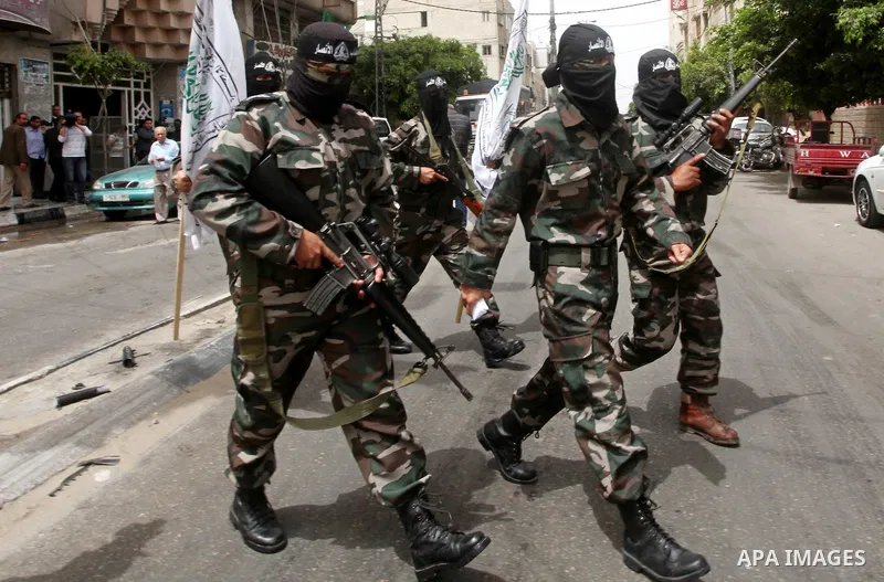 Palestinian militants of the Al-Ahrar Brigades, take part in a press conference, in Gaza city on April, 18, 2012 to announces readiness to defend the Palestinian prisoners in Israeli jails. Photo by Ashraf Amra
