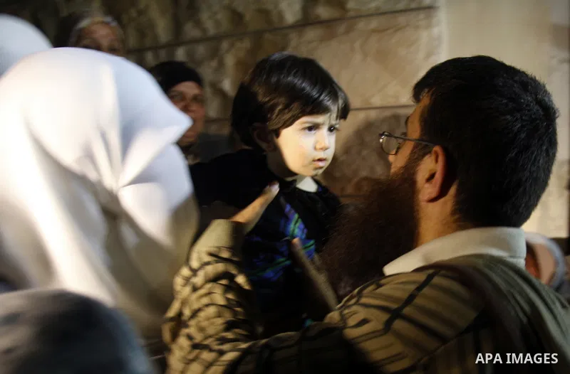Khader Adnan, a member of Islamic Jihad, gestures upon his arrival in the West Bank village of Arabe near Jenin after his release from an Israeli prison, April 17, 2012. Adnan, a prisoner who refused food for 66 days bef...