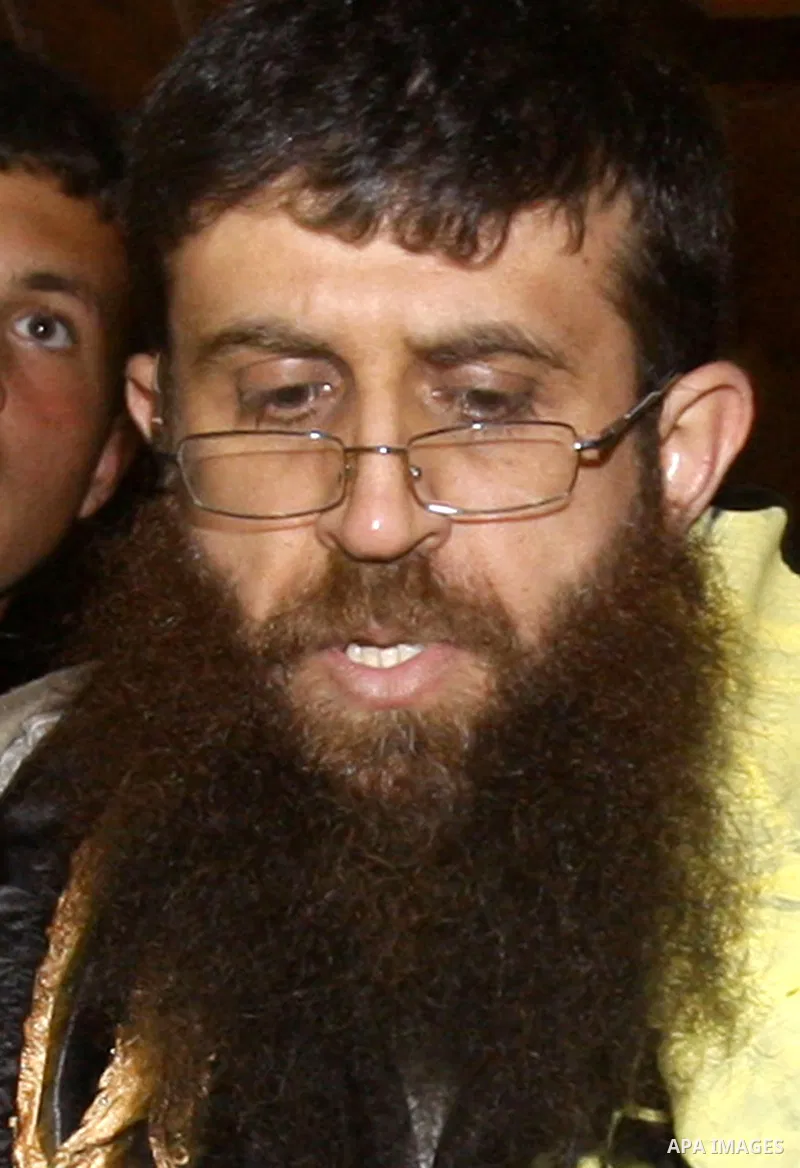 Khader Adnan, a member of Islamic Jihad, gestures upon his arrival in the West Bank village of Arabe near Jenin after his release from an Israeli prison, April 17, 2012. Adnan, a prisoner who refused food for 66 days bef...