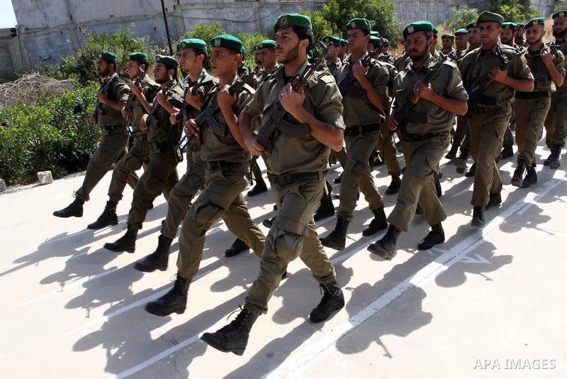 Palestinian Hamas National security force officers stand to attention during their graduation ceremony in Gaza City on April 19, 2012. Photo by Mohammed Asad