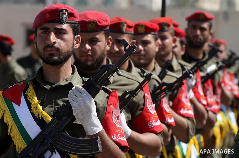 Palestinian Hamas National security force officers stand to attention during their graduation ceremony in Gaza City on April 19, 2012. Photo by Mohammed Asad