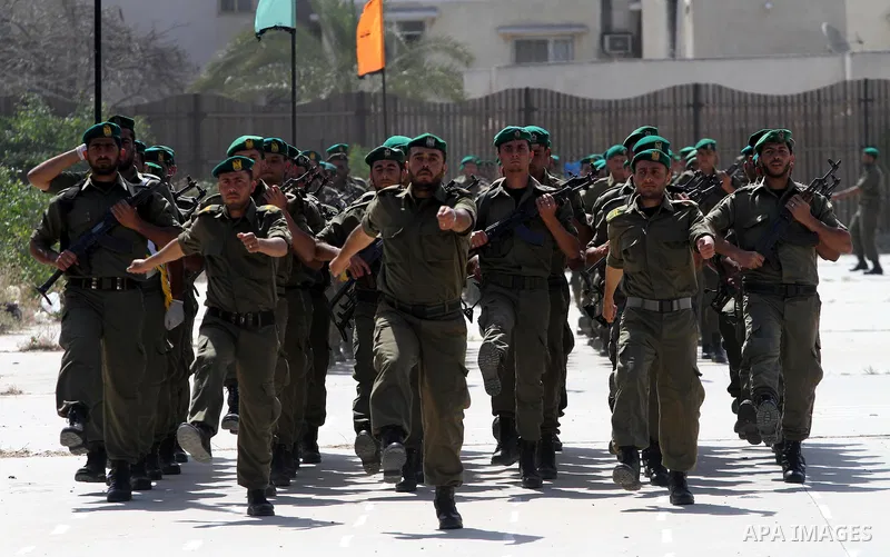 Palestinian Hamas National security force officers stand to attention during their graduation ceremony in Gaza City on April 19, 2012. Photo by Mohammed Asad
