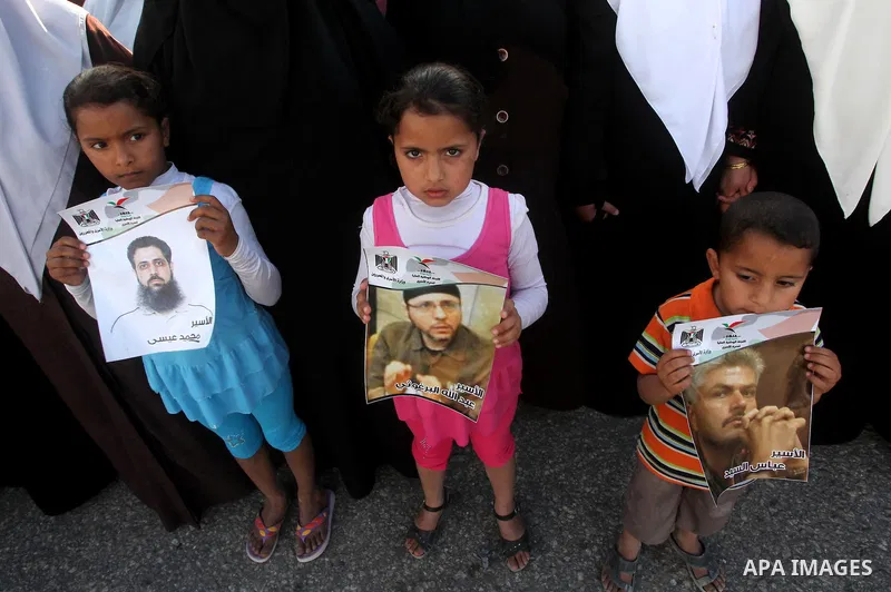 Palestinians participate in a demonstration calling for the release of Palestinian prisoners jailed in Israel, near Erez border crossing between Israel and the northern Gaza Strip, on April 19, 2012. Photo by Ashraf Amra