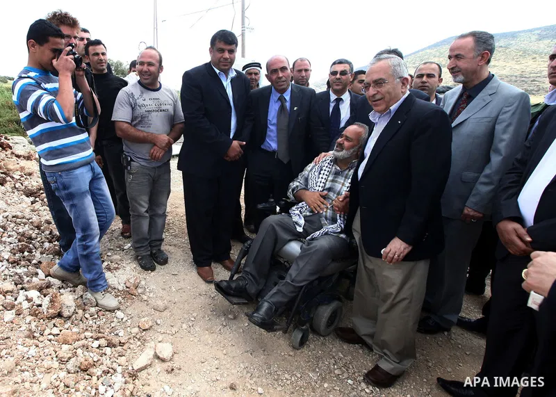 Palestinian prime minister Salam Fayyad during an inspecting visit in Tobas governorate and outskirts of the West Bank Jordan Valley. on April 19, 2012. Photo by Mustafa Abu Dayeh