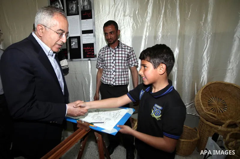 Palestinian prime minister Salam Fayyad during an inspecting visit in Tobas governorate and outskirts of the West Bank Jordan Valley. on April 19, 2012. Photo by Mustafa Abu Dayeh