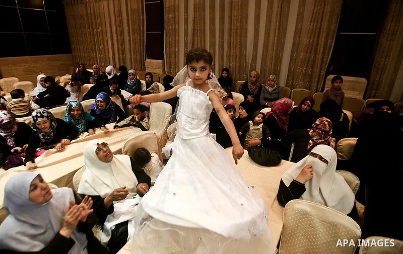 Palestinians celebrate during a mass wedding organized by Association of Altayseer for marriage. Around 60 young Palestinians Participated in the wedding in Gaza City on April 19, 2012. Photo by Ali Jadallah