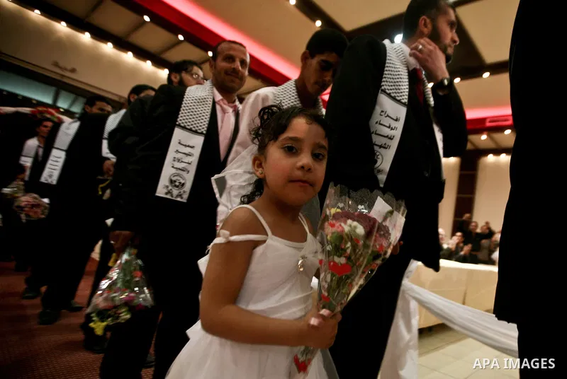 Palestinians celebrate during a mass wedding organized by Association of Altayseer for marriage. Around 60 young Palestinians Participated in the wedding in Gaza City on April 19, 2012. Photo by Ali Jadallah