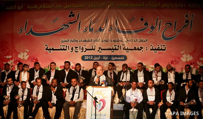 Palestinians celebrate during a mass wedding organized by Association of Altayseer for marriage. Around 60 young Palestinians Participated in the wedding in Gaza City on April 19, 2012. Photo by Ali Jadallah