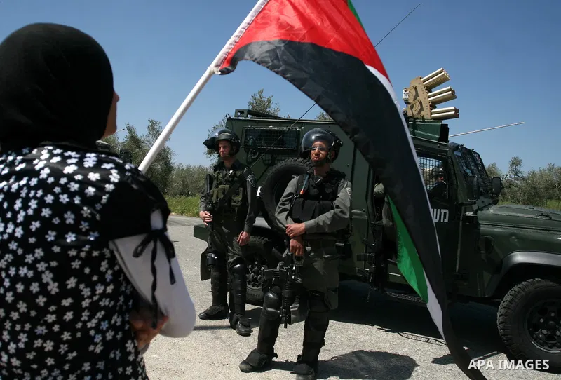 Palestinian and foreign activists confront Israeli soldiers during clashes in the weekly Friday demonstration in the West Bank village of Nabi Saleh, on April 20, 2012, against the construction of the nearby Jewish settl...