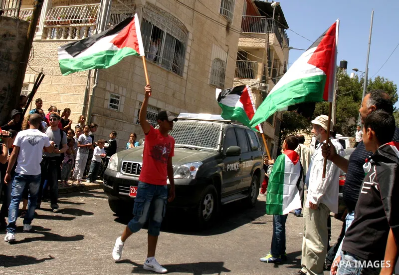 Palestinian demonstrate on the Mount of Olives, which overlooks the Dome of the Rock in the Al-Aqsa mosque compound, as they protest against the Jewish settlers who live in the Israeli annexed Arab East Jerusalem's a-Tur...