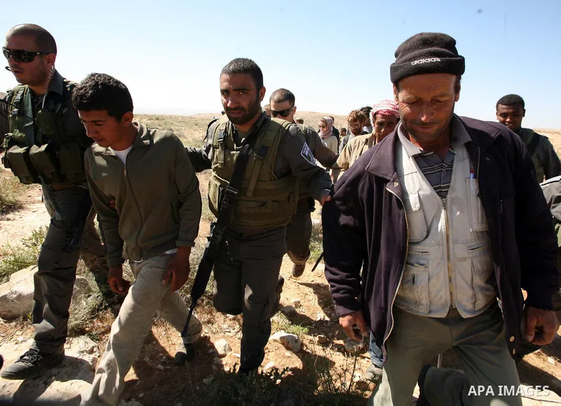 Israeli soldiers scuffle with Palestinian protesters during the weekly demonstration against settlement in the West Bank village Beit Ommar near Hebron.on April 21, 2012. Photo by Mamoun Wazwaz