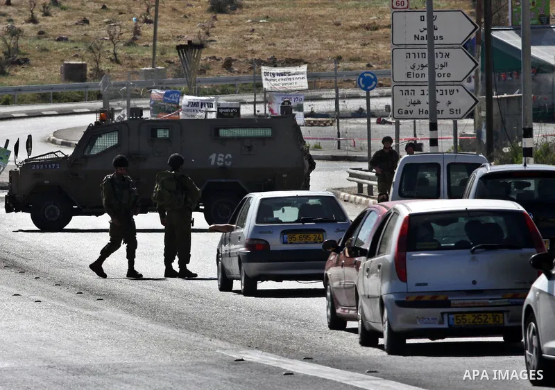 Israeli soldiers closed Tappuah checkpoint, after arrested two Palestinians young their has a pistol and explosion materials. southern Nablus city in the west bank,on April 21, 2012. Photo by Nedal Eshtaya