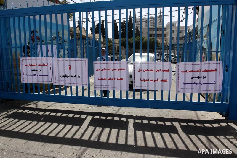 Palestinians participate during a protest in front of the UNRWA office against the mechanism Intelligence investigation that uses to their staff in Gaza City, on April 22, 2012. Photo by Mohammed Asad