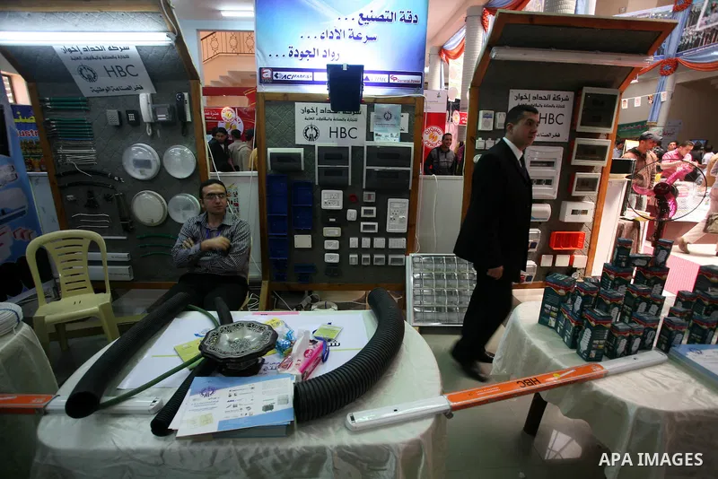 Palestinians participate in the opening of an exhibition of national products at the Islamic University in Gaza city on April 22, 2012. Photo by Naaman Omar