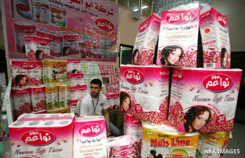 Palestinians participate in the opening of an exhibition of national products at the Islamic University in Gaza city on April 22, 2012. Photo by Naaman Omar