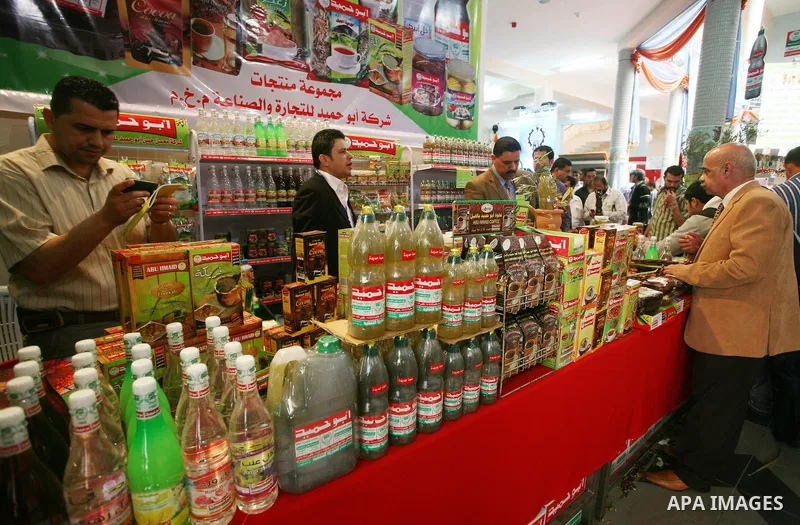 Palestinians participate in the opening of an exhibition of national products at the Islamic University in Gaza city on April 22, 2012. Photo by Naaman Omar