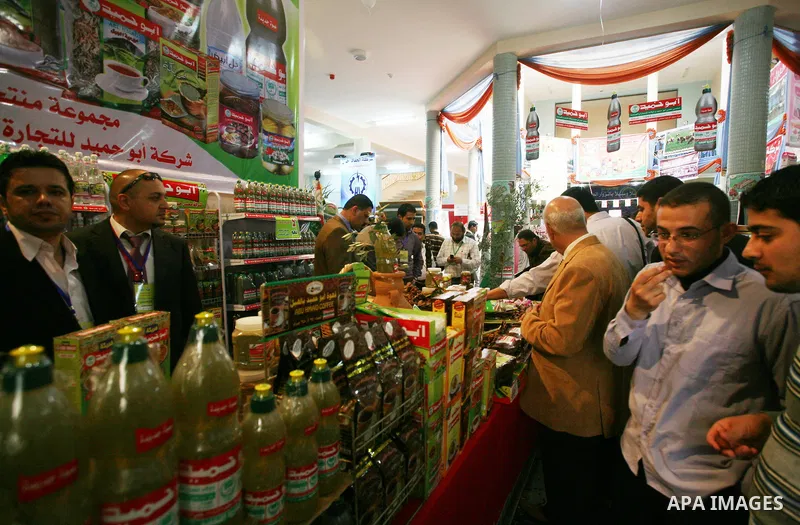 Palestinians participate in the opening of an exhibition of national products at the Islamic University in Gaza city on April 22, 2012. Photo by Naaman Omar