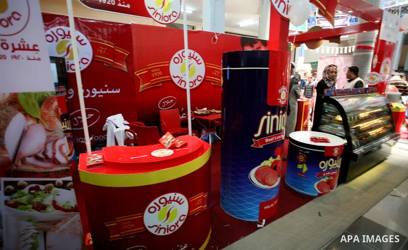 Palestinians participate in the opening of an exhibition of national products at the Islamic University in Gaza city on April 22, 2012. Photo by Naaman Omar