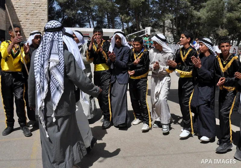 Palestinian school students dance during the Open Day Festival in the city of Nablus in the West Bank, on April,22 2012. Photo by Nedal Eshtaya