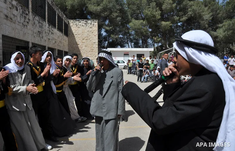 Palestinian school students dance during the Open Day Festival in the city of Nablus in the West Bank, on April,22 2012. Photo by Nedal Eshtaya