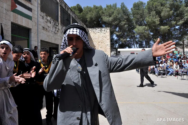 Palestinian school students dance during the Open Day Festival in the city of Nablus in the West Bank, on April,22 2012. Photo by Nedal Eshtaya